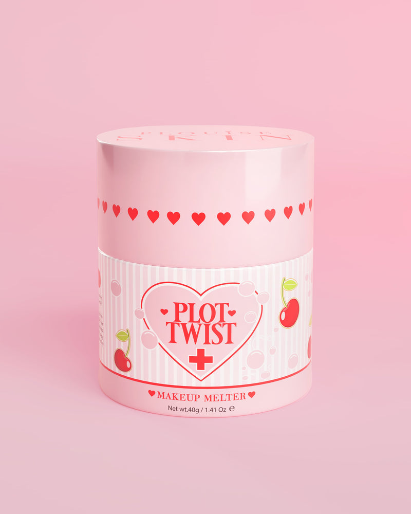 Een roze verpakking P.Louise Plot Twist Makeup Melting Cleansing Balm met hart- en kersenmotieven op het etiket tegen een roze achtergrond