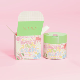 P.Louise 'What's the Scoop?' stretchy body scrub in mixed fruit scent with a mixed fruit design packaging on a pink background