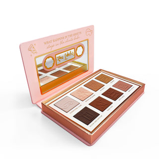 The P.Louise Love Tapes Beneath The Sheets Makeup Palette containing 8 velvety matte shades of eyeshadow with text labels for each shade, presented in a rose gold and pink video tape packaging with intricate designs.