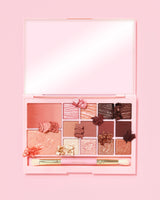 An image of the P. Louise Breakfast Bites All In One Makeup Palette in Hot To Go in a neutral & mauve colour way  on a pink background