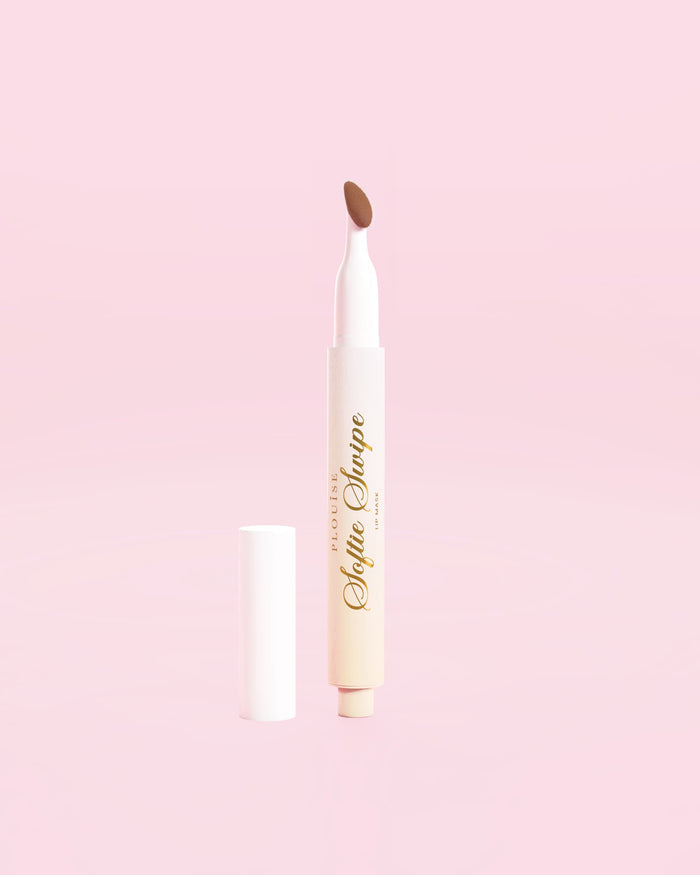 An image of a P.Louise Softie Swipe Tinted Lip Mask in Soft Launch against a pink background