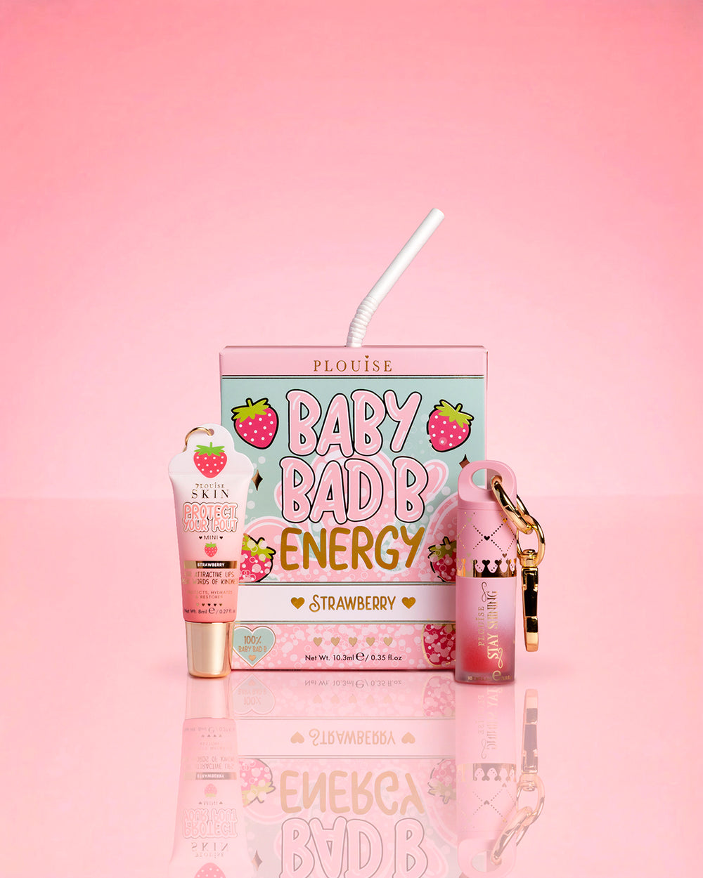 P.Louise Strawberry Baby Bad B Mini Lip Oil & Mini Lip COnditioner on a pink background