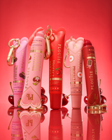 Set of P.Louise cherry scented tinted protect your pout lip conditioner tubes on a red background