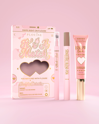 Het is een cosmetische wenkbrauwset van A Match, inclusief P.Louise Signature Blend Pen, Blade & Fade Brow Pencil en Brow Balm, verpakt in roze en gouden themadozen met hartmotieven.