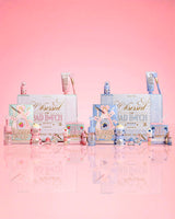 Collection of P.Louise strawberry and blueberry beauty products with 'Obsessed For Bad Bitch' packaging on a pink background